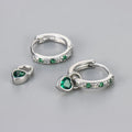 Women's heart-shaped drop earrings with coloured gemstones in gold and white gold tone settings