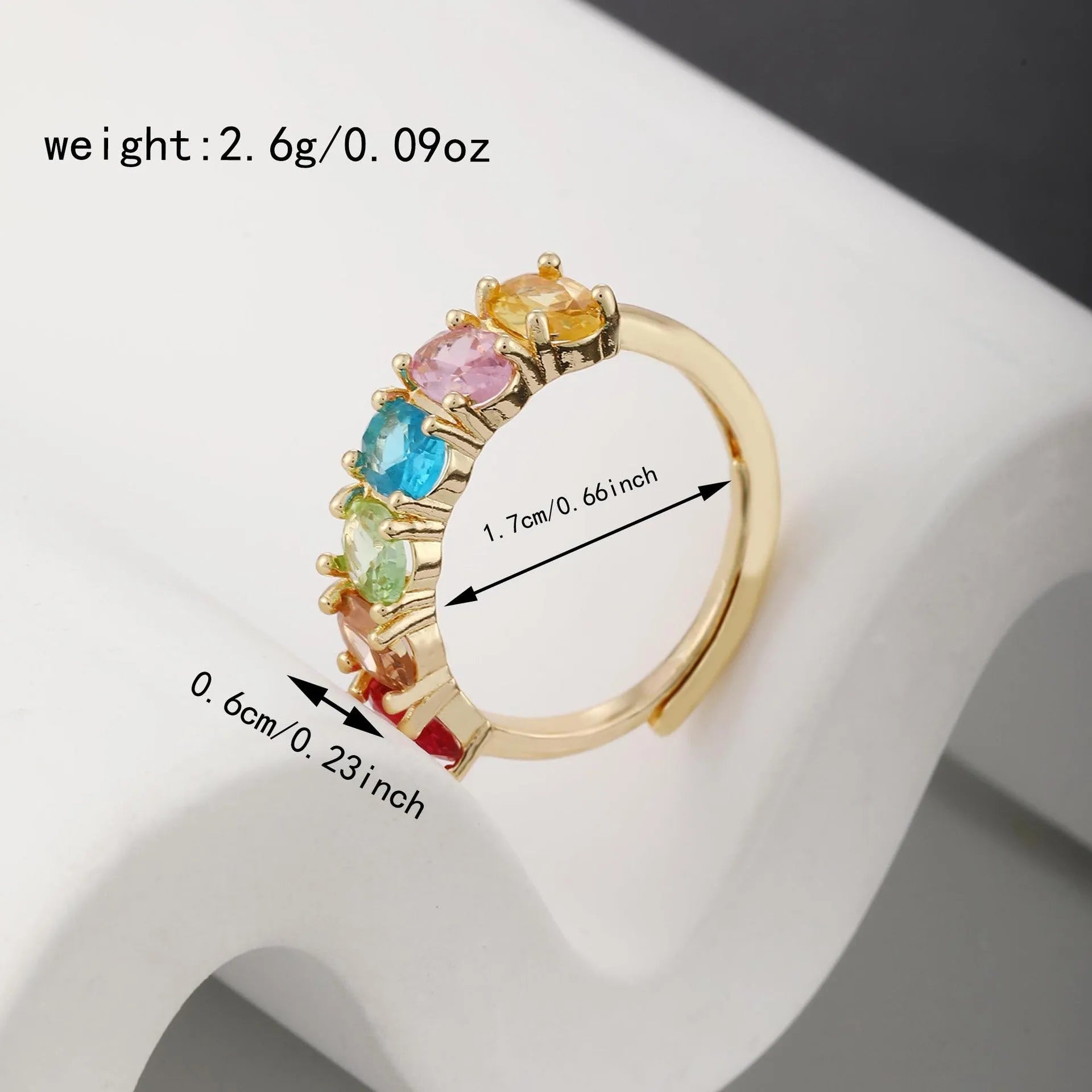 Gold-colour adjustable zircon ring with a simple retro design on a white background.