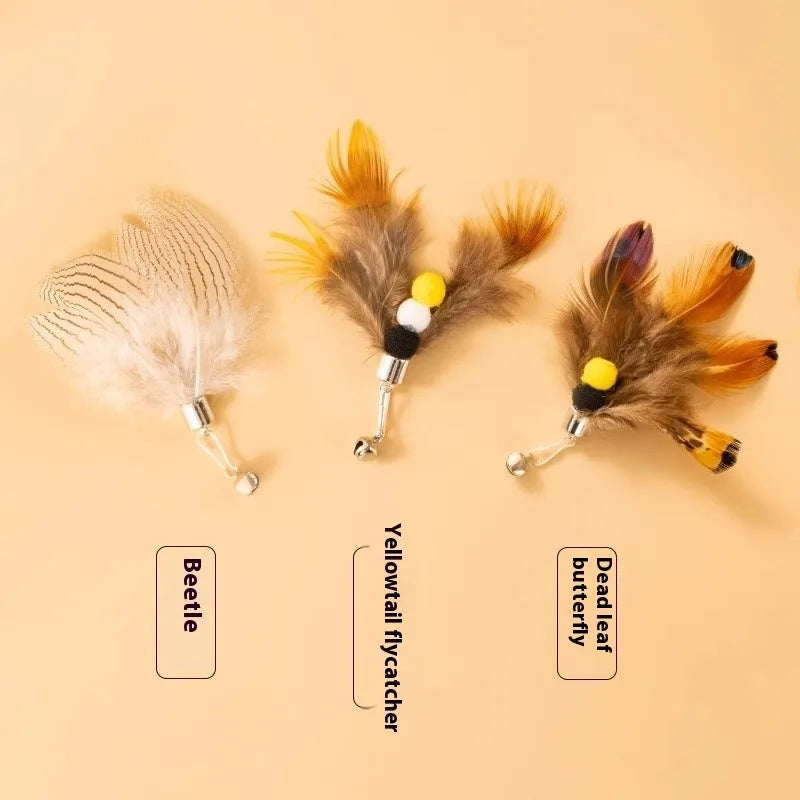 Three steel wire cat toy replacement heads with small flying insect designs in varied colours