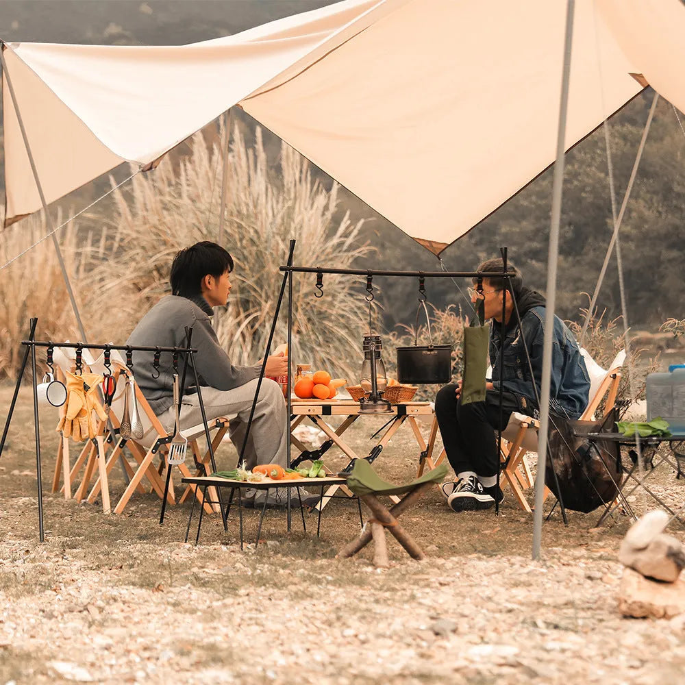 Large foldable aluminium camping drying rack with multiple hooks, set up outdoors.