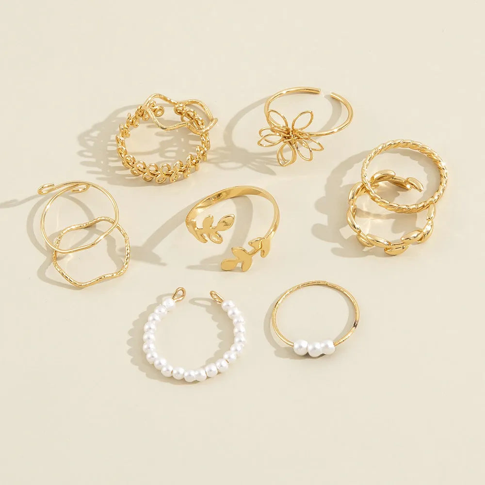 Women's openwork flower ring set with glossy gold finish and floral design