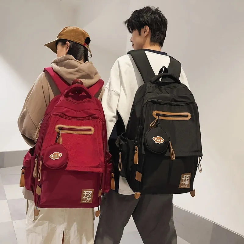 Large nylon school backpack for junior high school students with curved shoulder straps, shown in a solid colour.