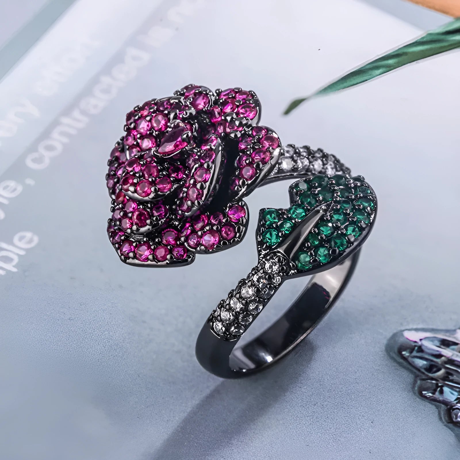 Black gold geometric flower ring with red simulation stones on gold-plated copper band
