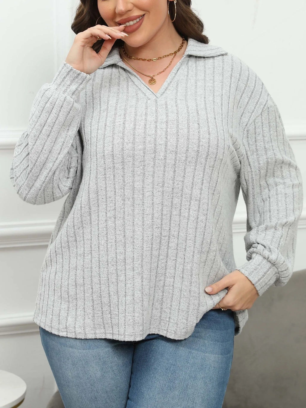 Women's plus size gray polo collar shirt with full lantern sleeves in a street fashion style.