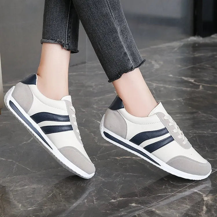 Blue and red lace-up low top sneakers with mesh upper and rubber sole
