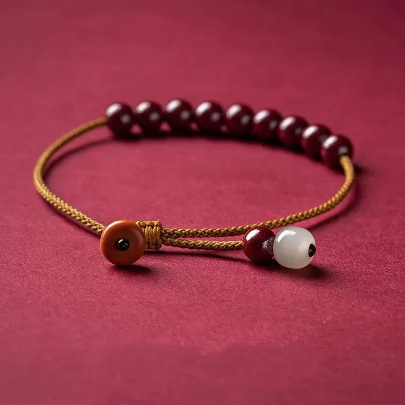 Hand-woven cinnabar geometric bracelet with a raw ore design.