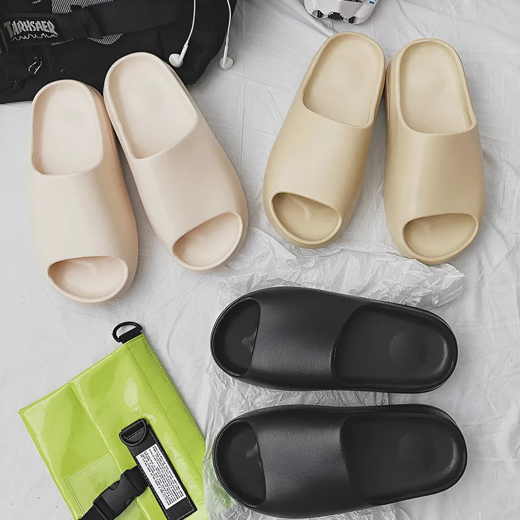Women's thick-soled beach slippers in green, shown on a white background.
