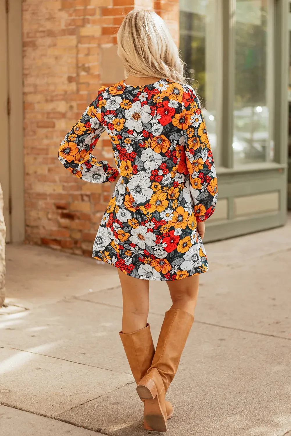 Orange floral print striped lace V-neck long sleeve mini dress on mannequin