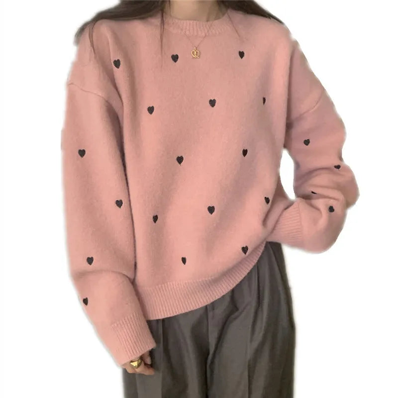 Women's loose-fit acrylic pullover sweater with embroidered love pattern in milky white.