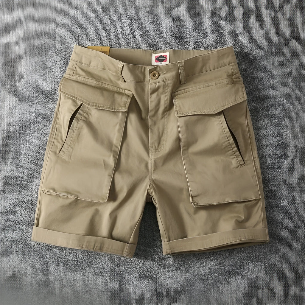 Men's straight-leg cotton cargo shorts in khaki with multiple pockets, shown for summer street style.