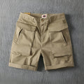 Men's straight-leg cotton cargo shorts in khaki with multiple pockets, shown for summer street style.