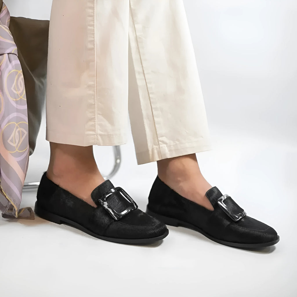 Low-cut black loafers for women with large square button and rhinestone details, round toe, low heel