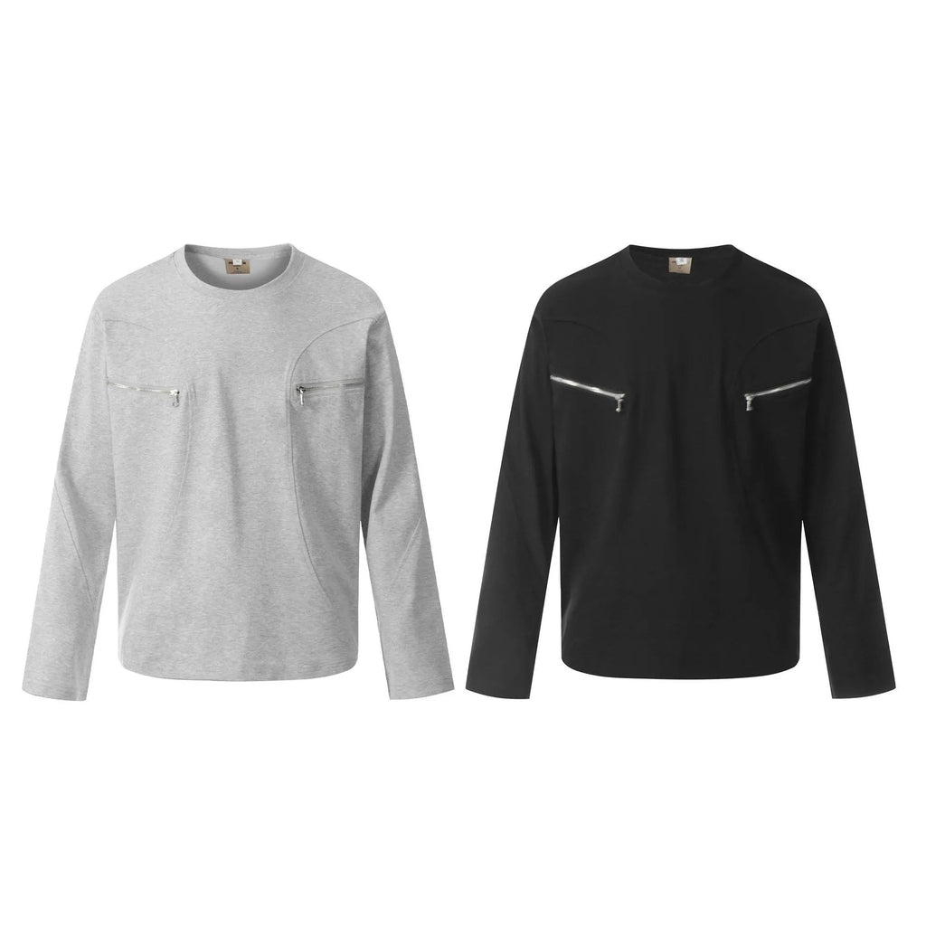 Man wearing a loose black cotton pullover top with long sleeves in a casual setting.