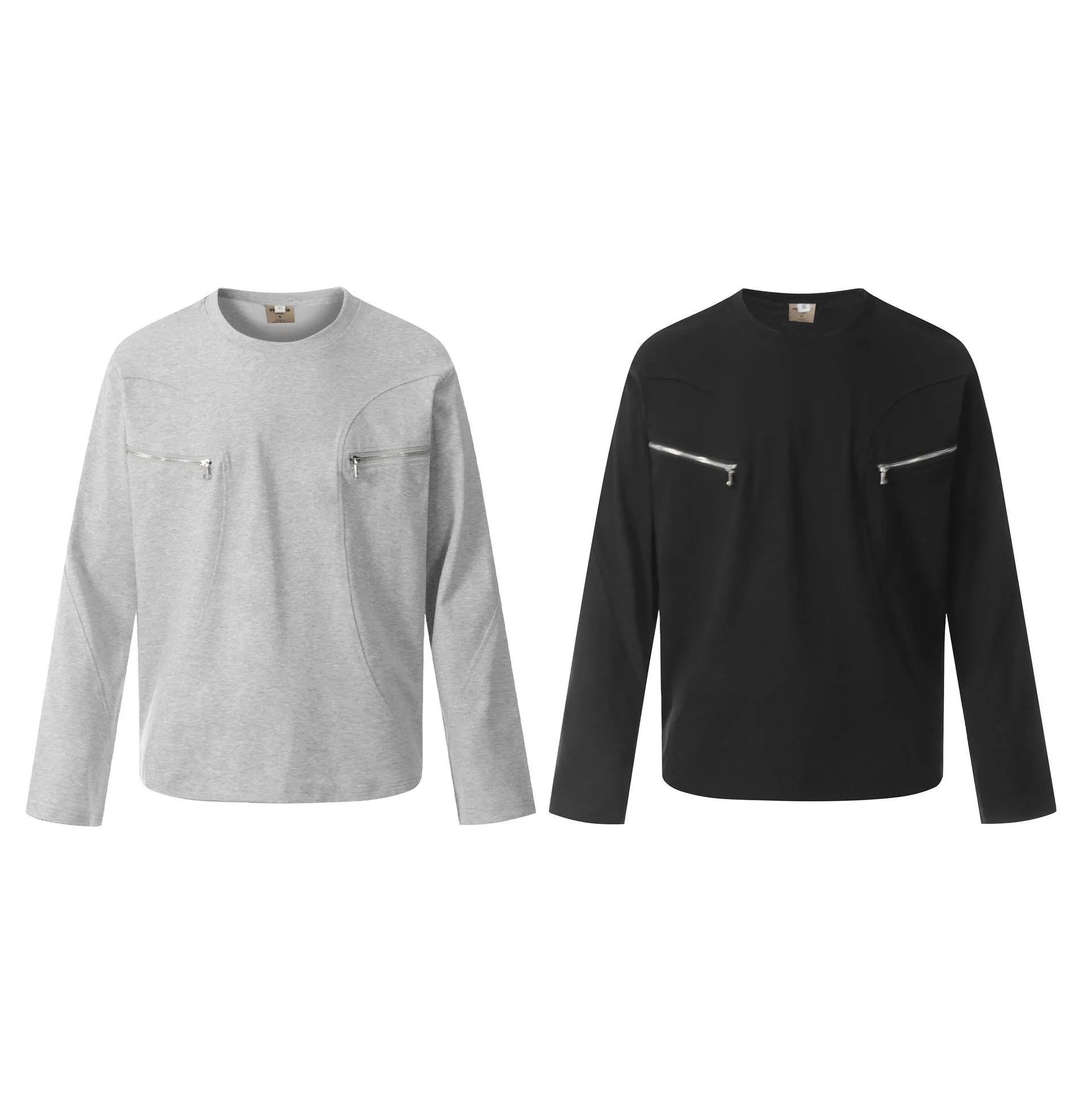Man wearing a loose black cotton pullover top with long sleeves in a casual setting.