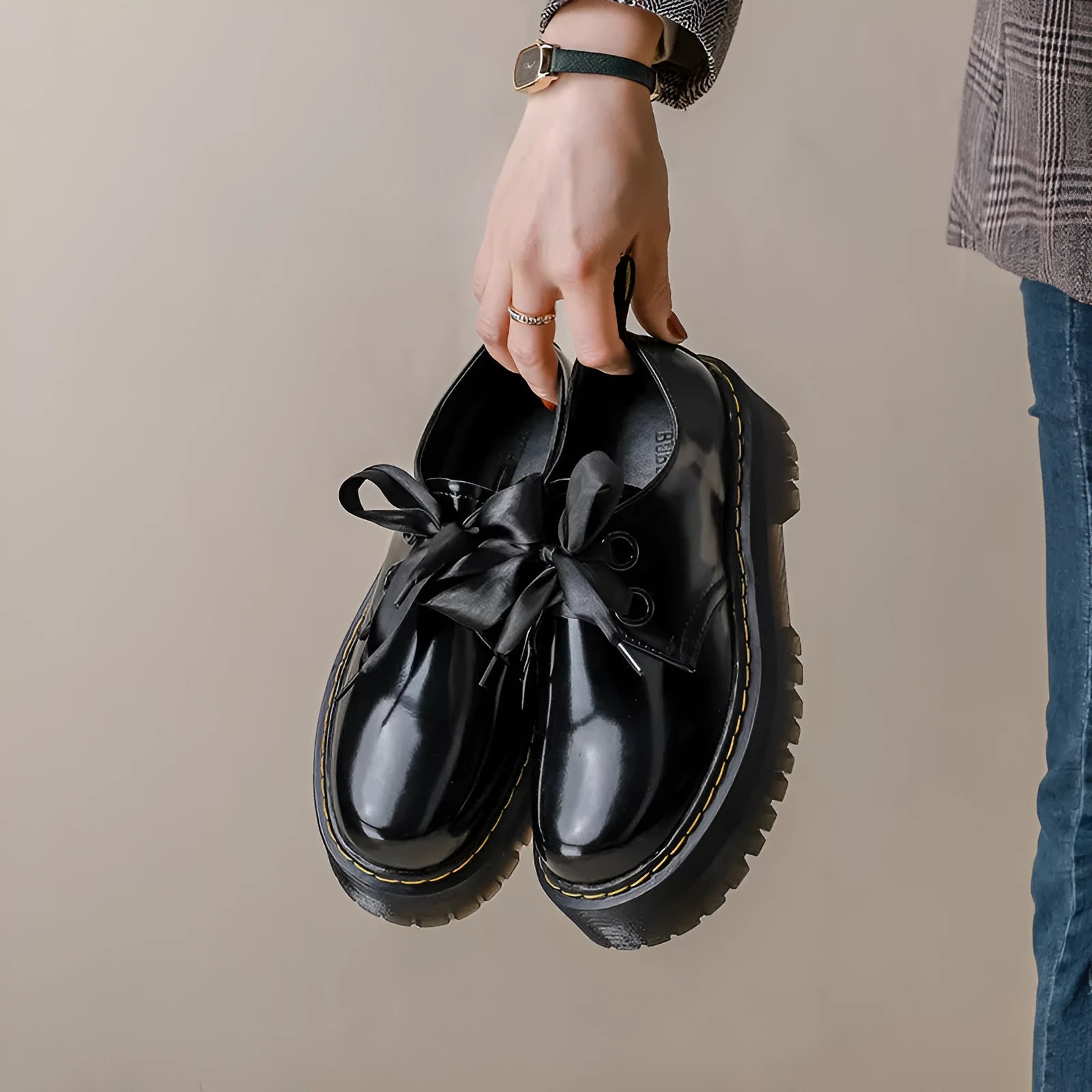 Women's black leather shoes with thick sole and cross-strap design