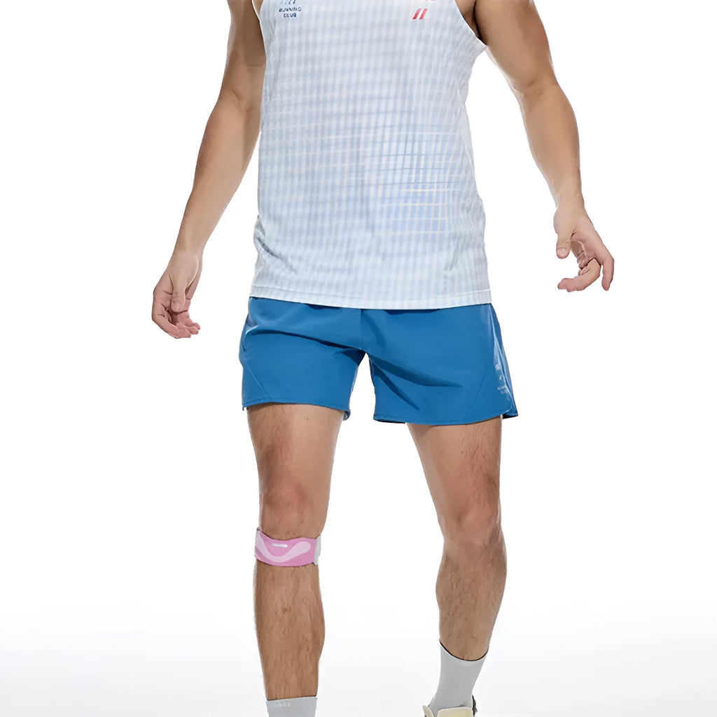 Black running shorts with laser stitching detail on a grey background.