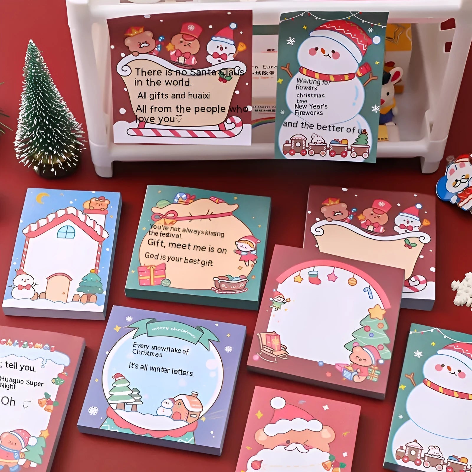 Christmas sticky notes book showing eight festive cartoon designs including elf, Santa, and snowman patterns