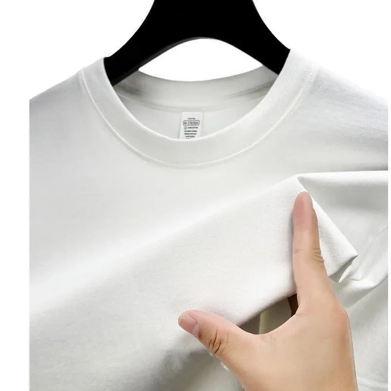 Men's drop shoulder solid colour cotton T-shirt in white, front view, short sleeves, relaxed fit