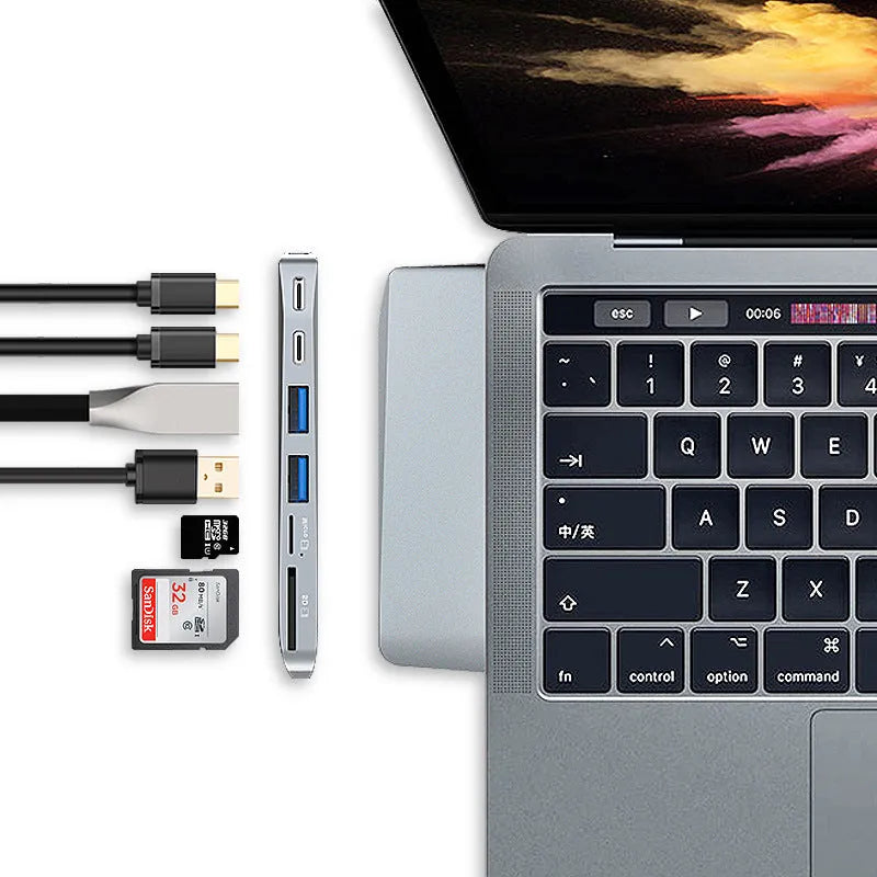 USB-C expansion hub with dual connectors for 2015-2018 MacBook Pro showing eight interface ports