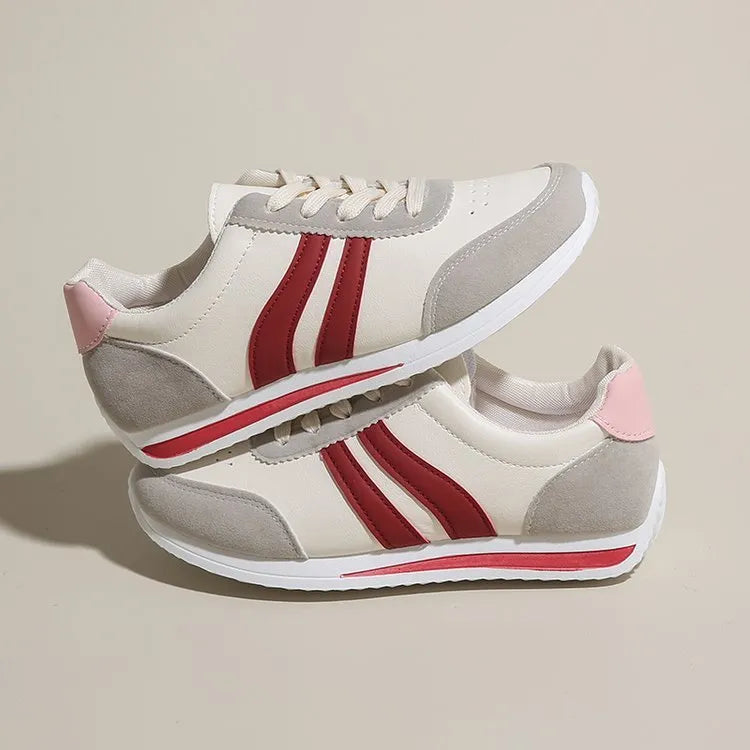 Blue and red lace-up low top sneakers with mesh upper and rubber sole
