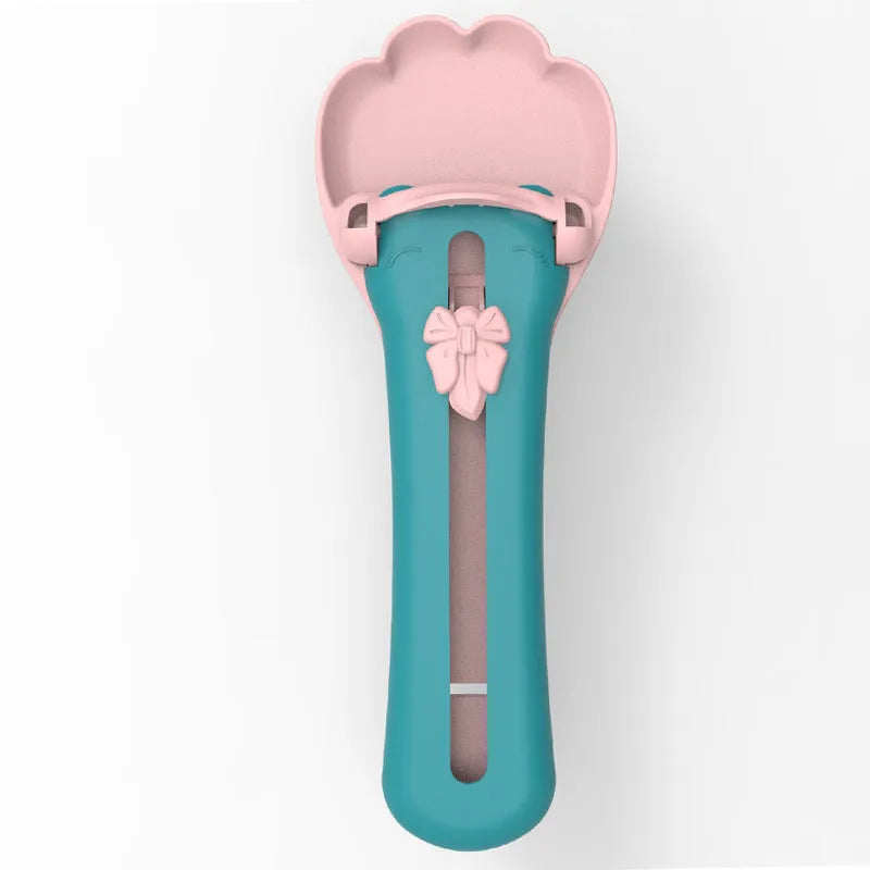 Green pet food scoop with transparent 25 ml chamber and wide handle for dispensing liquid food.
