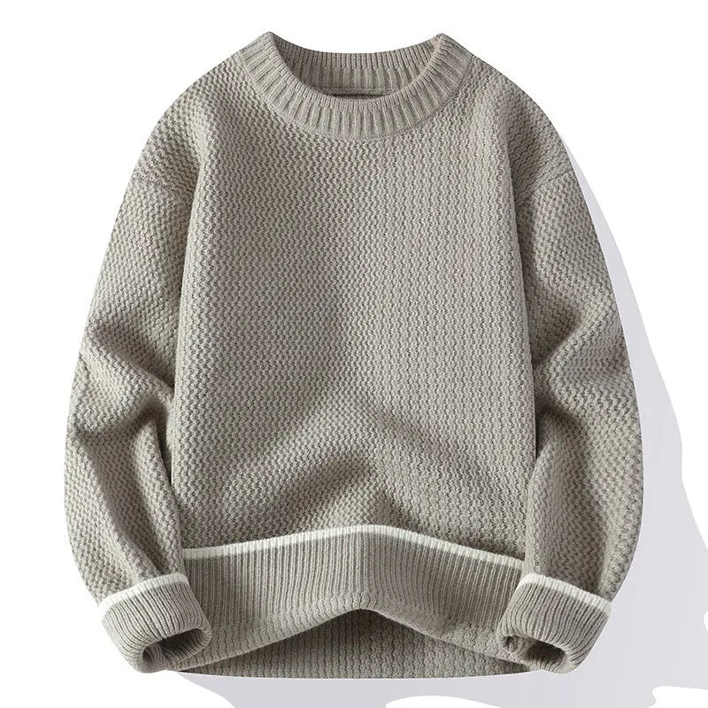 Man wearing a loose grey round neck pullover sweater, casual autumn outfit