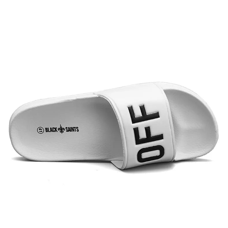 Men's black open-toe slippers with a rubber sole, shown from the side.