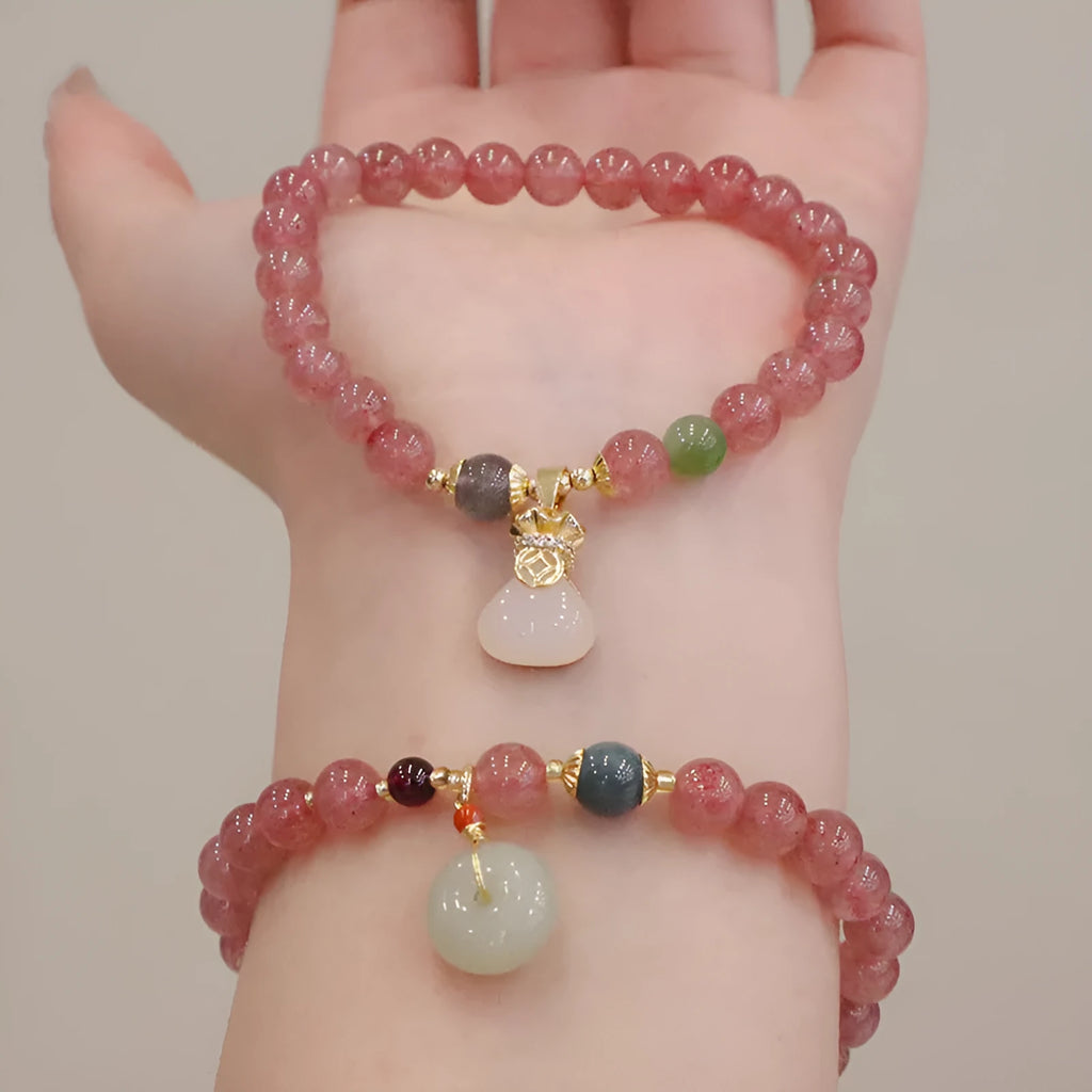 Geometric purse-style strawberry quartz bracelet for women with a peace buckle and safety clasp.