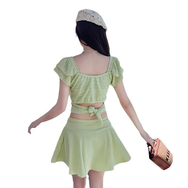 Women's split skirt-style bathing swimsuit in polyester and spandex, black colour, with top and separate skirt