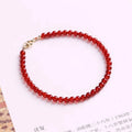 Ultra-thin red agate calm small bracelet for women classic style on neutral background