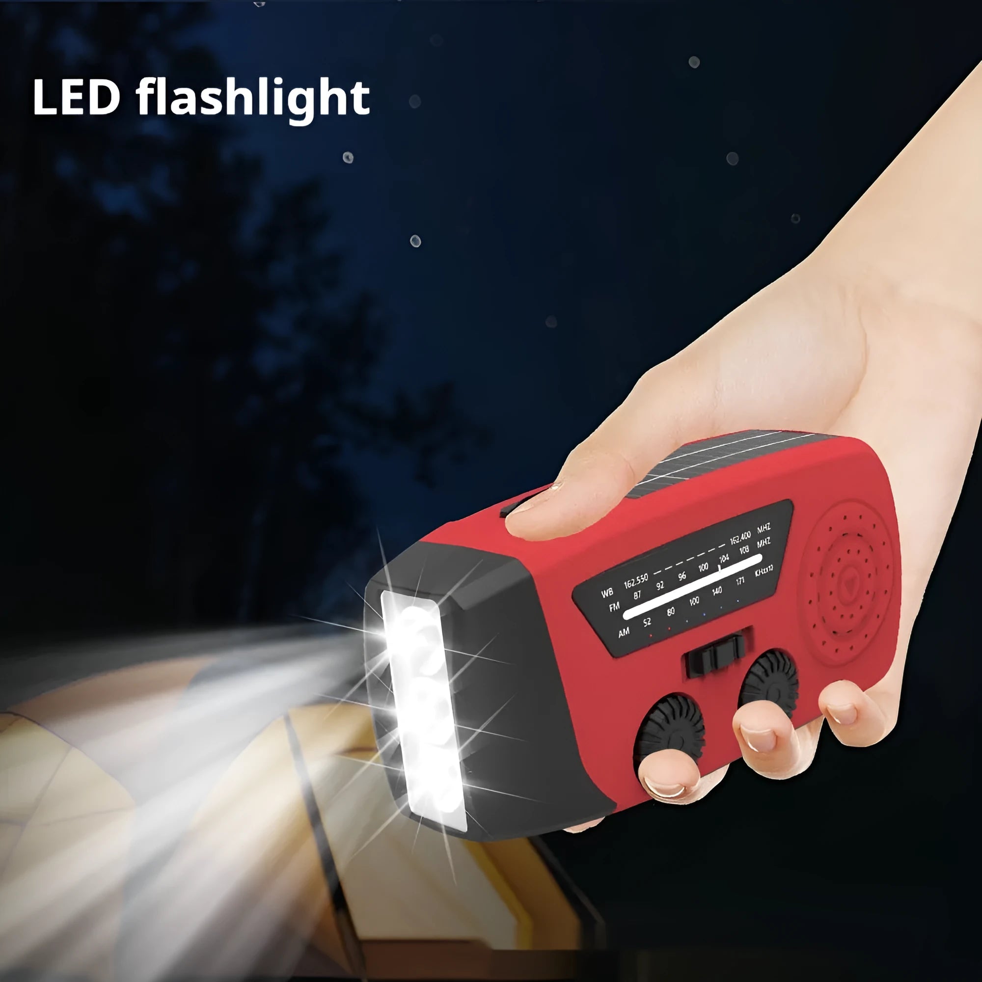 Red rechargeable hand radio emergency torch with ABS body, USB port, and wrist strap on plain background