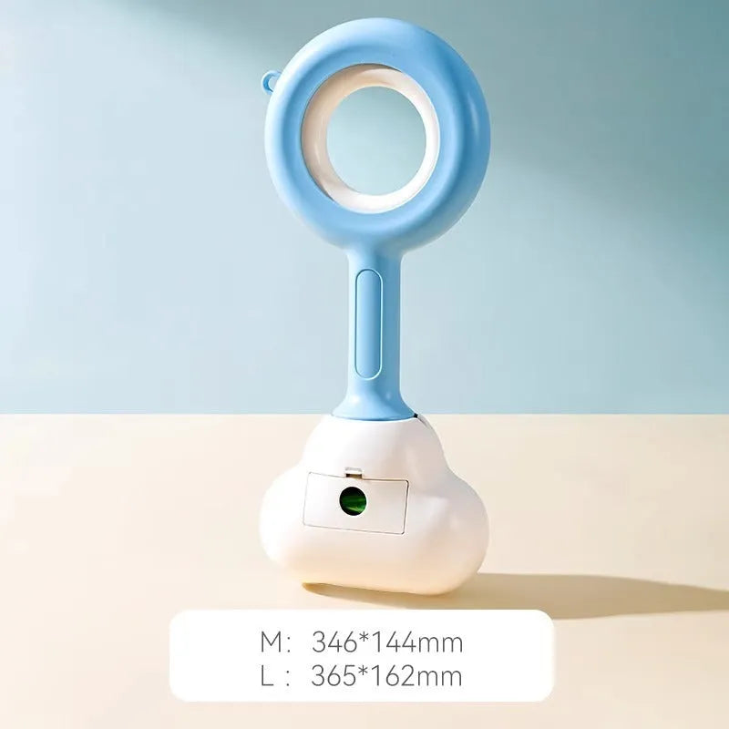 Pet dog pooper scooper with cloud shape jaw in blue colour on grass
