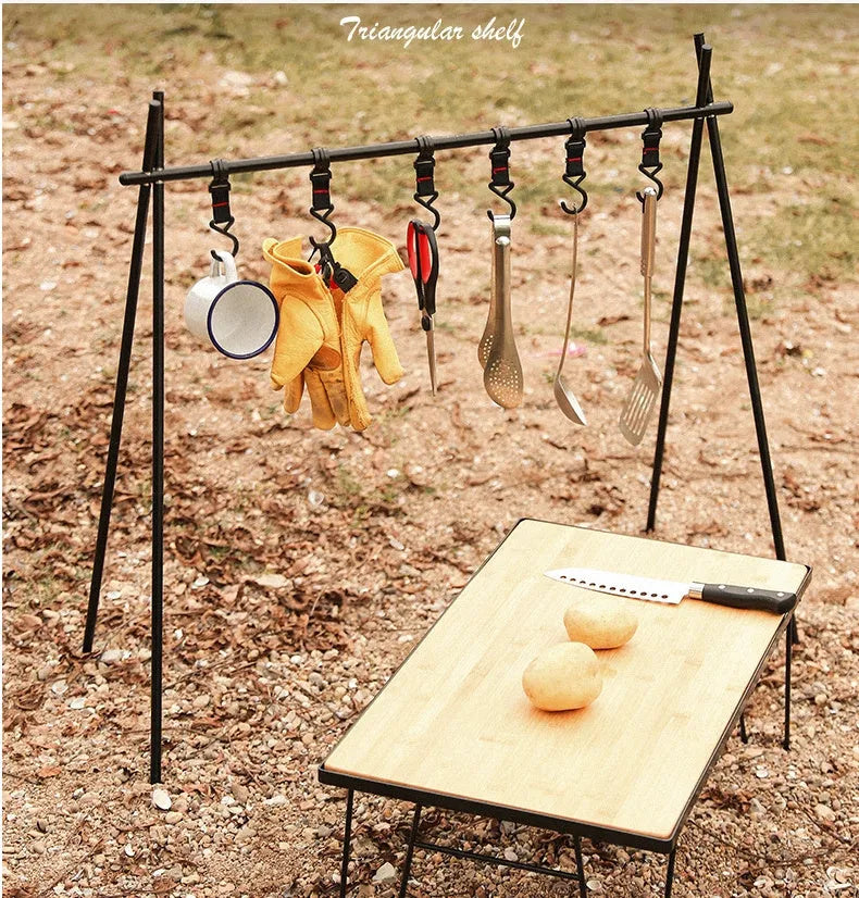Large foldable aluminium camping drying rack with multiple hooks, set up outdoors.