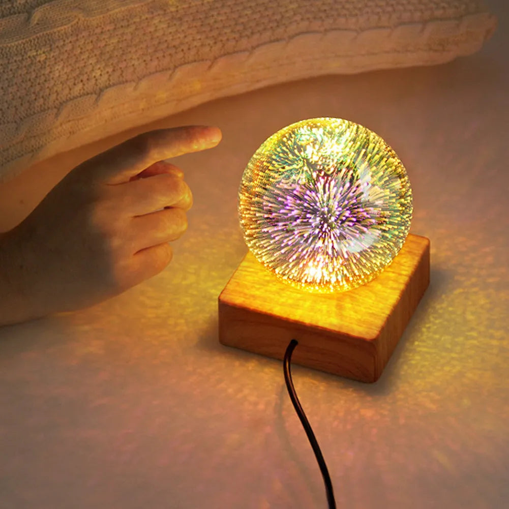 USB 3D firework crystal ball night light with warm LED, touch control, and starry sky effect on a wooden desk