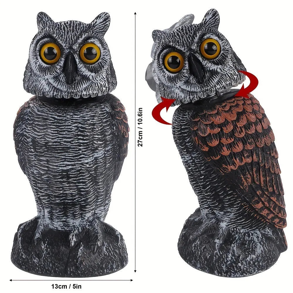 Artificial owl garden ornament with shaking head for bird deterrent on patio