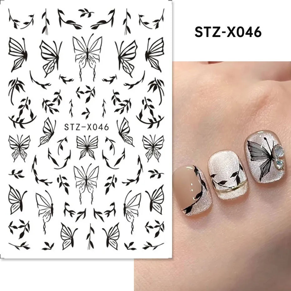 Black and silver strip pattern nail art stickers with cartoon designs on plastic backing.