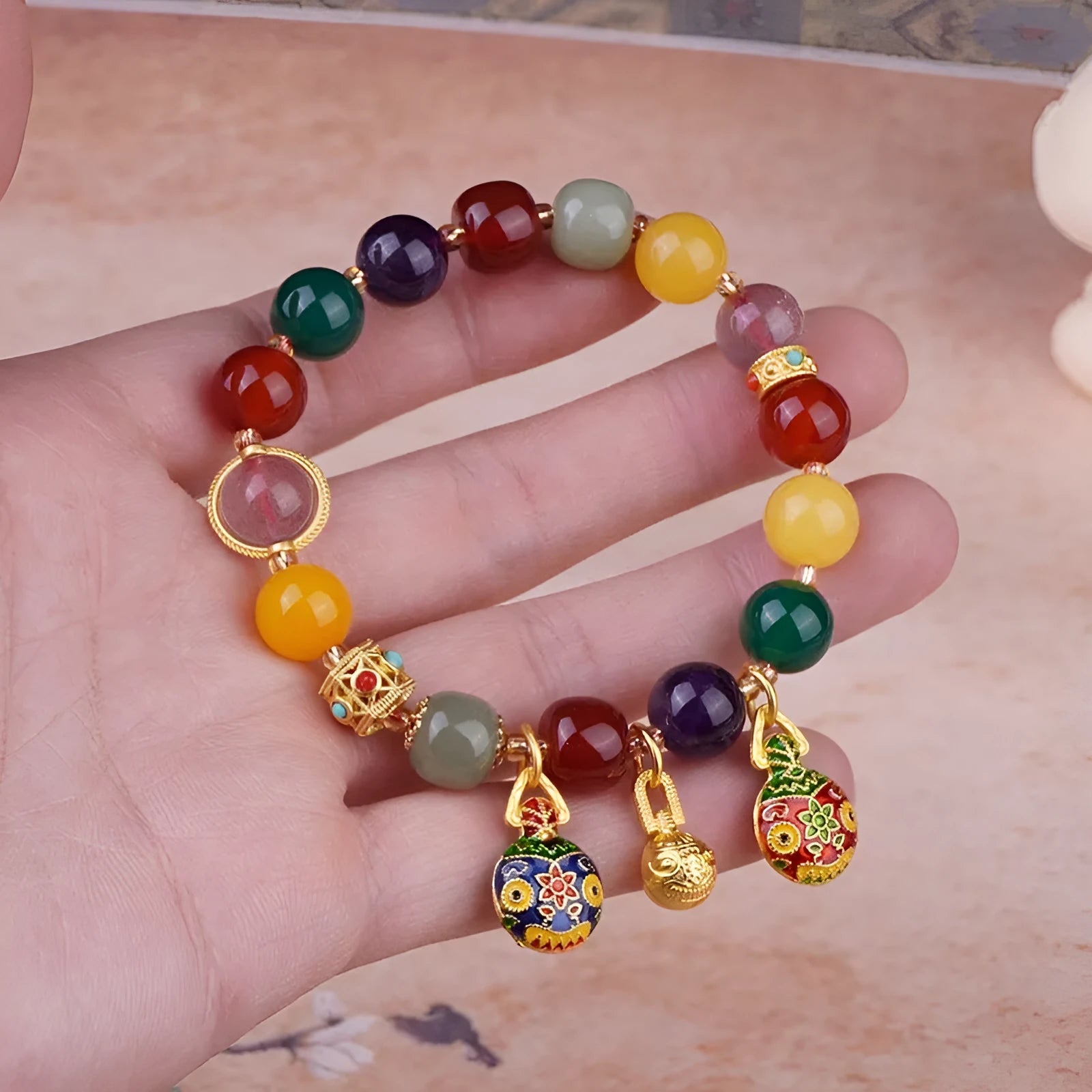 Swallowing Gold Beast agate crystal bracelet with 10mm beads, hand-woven, animal zodiac style on neutral background