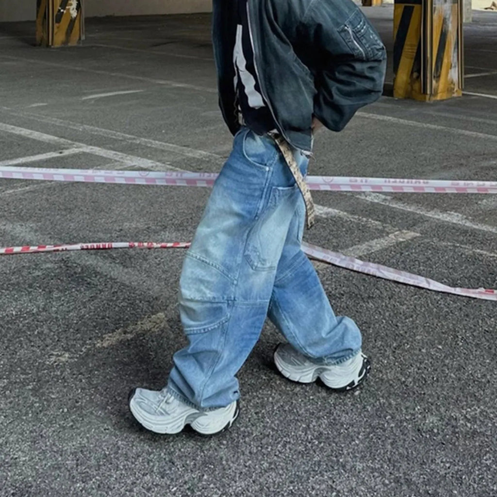 Profile Pleated baggy straight-leg washed white blue jeans on model