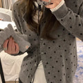 Grey Korean-style women's cardigan with white crocheted flower details on a mannequin.