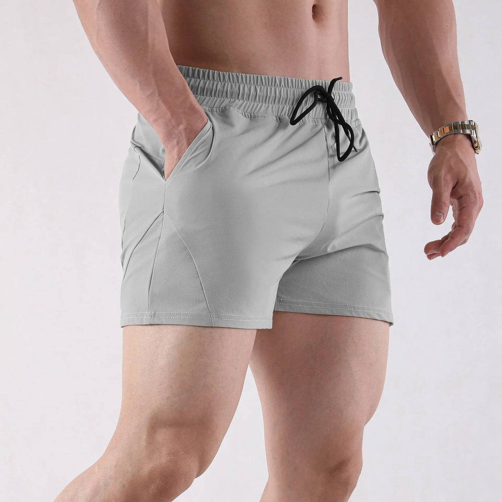 Men's polyester basketball shorts in grey, black, apricot or green with elastic waistband