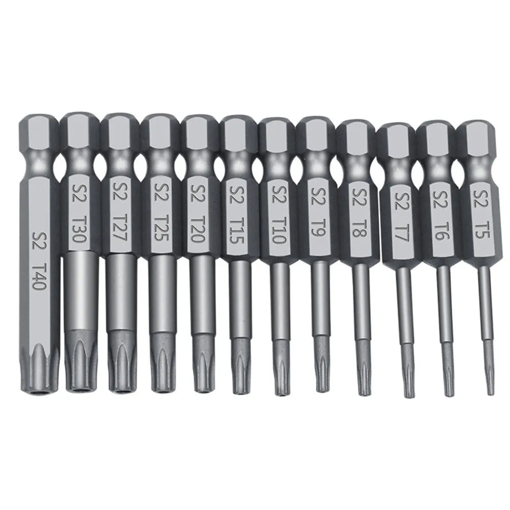 Alloy hexagon handle screwdriver bit set with plum blossom hollow bits in 50mm, 75mm, and 100mm lengths on a workbench
