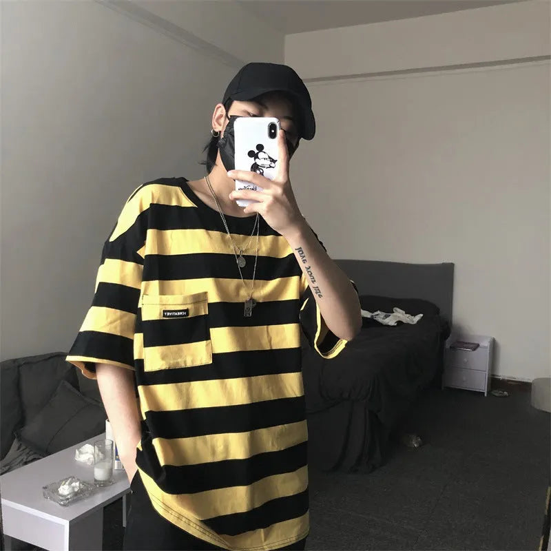 Striped short sleeve t-shirt in polyester fibre, available in blue and yellow, sizes L to XXL.