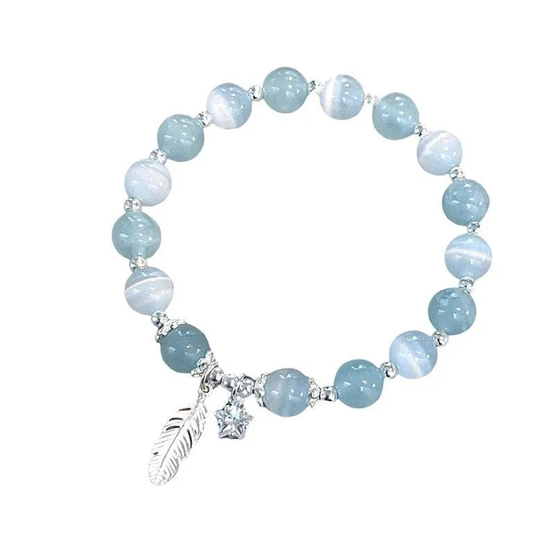 Small white girl crystal bracelet in Feather XINGX Blue Moonlight with eight Awn star and text design