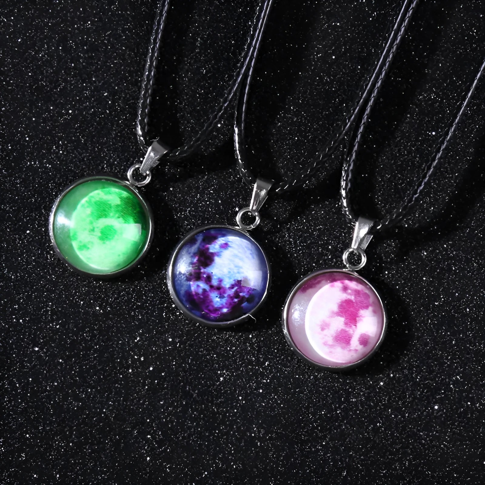Luminous alloy pendant necklace with Christmas moon, night sky, and constellation design on a glass centrepiece.