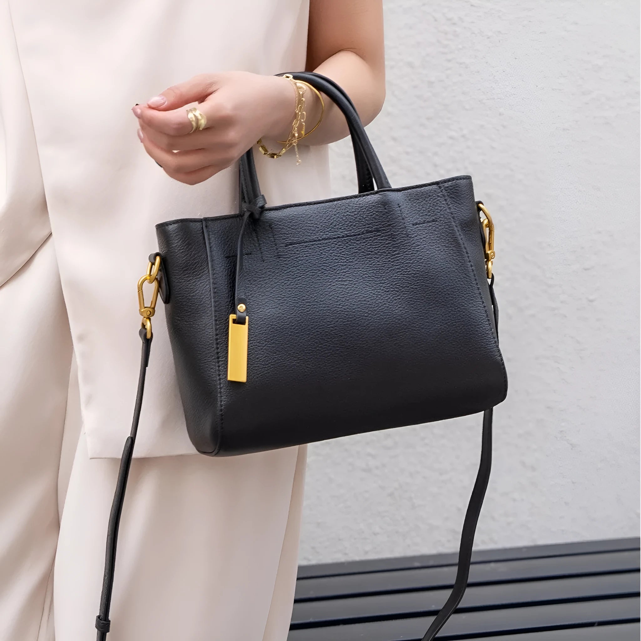 Portable genuine leather women handbag in soft cowhide with horizontal square shape and single strap, available in multiple colours
