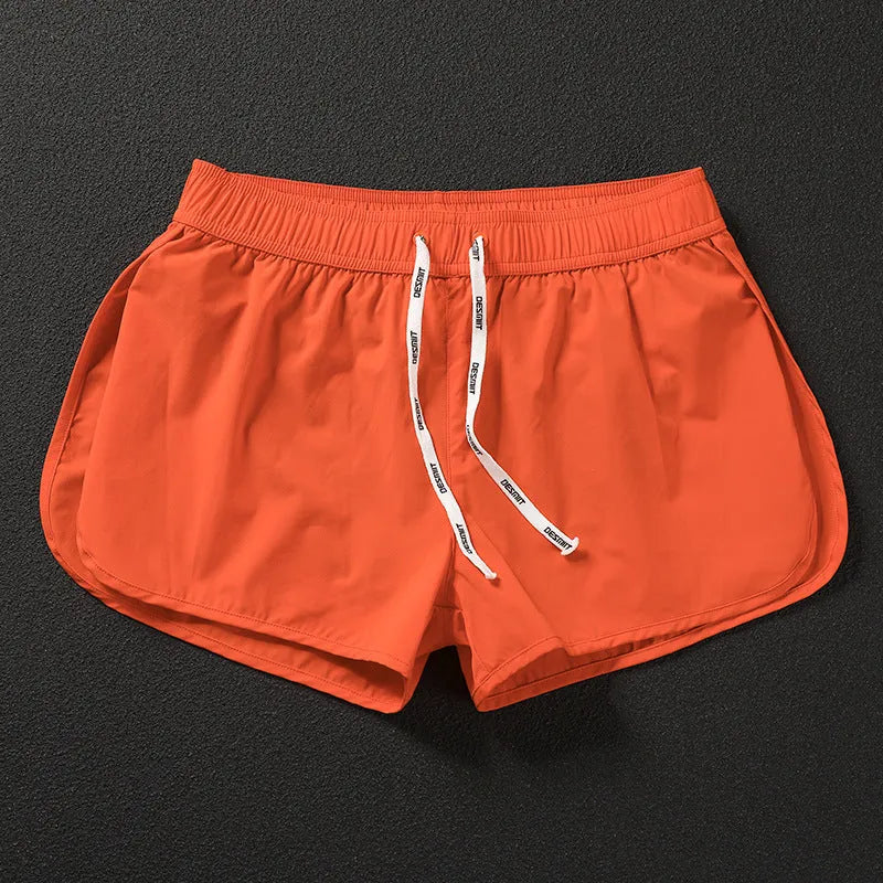 Men's loose beach surfing shorts in orange, green or black with elastic waistband