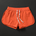 Men's loose beach surfing shorts in orange, green or black with elastic waistband