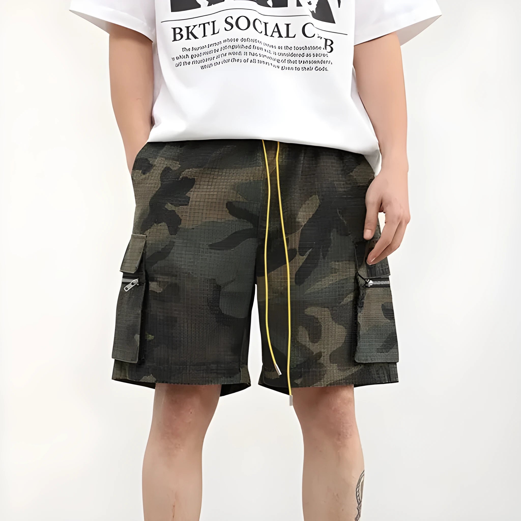 Multi-pocket camouflage workwear shorts for men with mid-waist cropped design and thin fabric, shown in a flat lay.