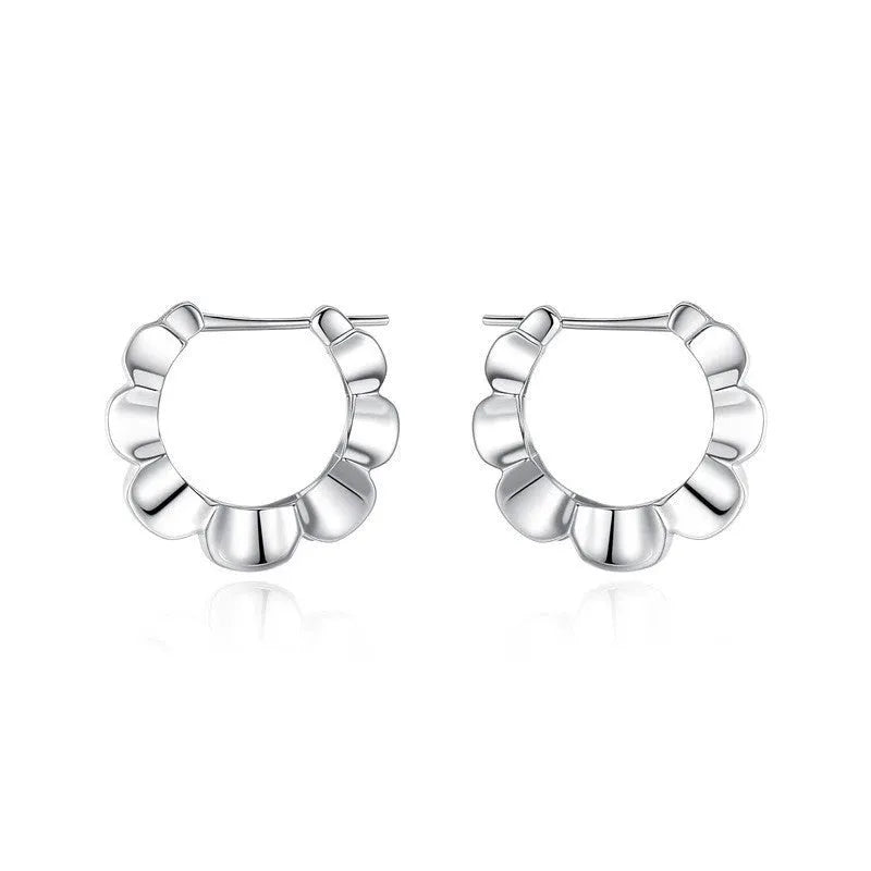 A pair of sterling silver geometric earrings with round details and an electroplated finish.