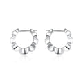 A pair of sterling silver geometric earrings with round details and an electroplated finish.